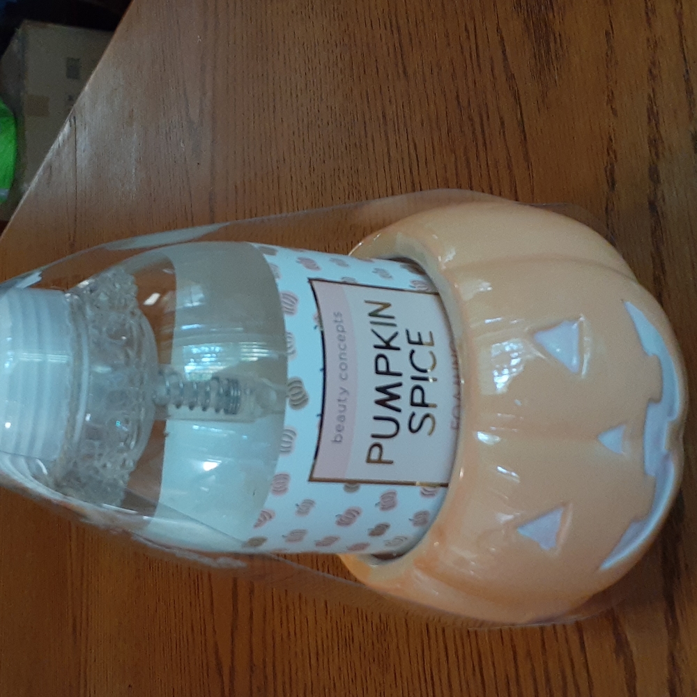 An Adorable ceramic pumpkin soap dispenser With Pumkin Spice Soap